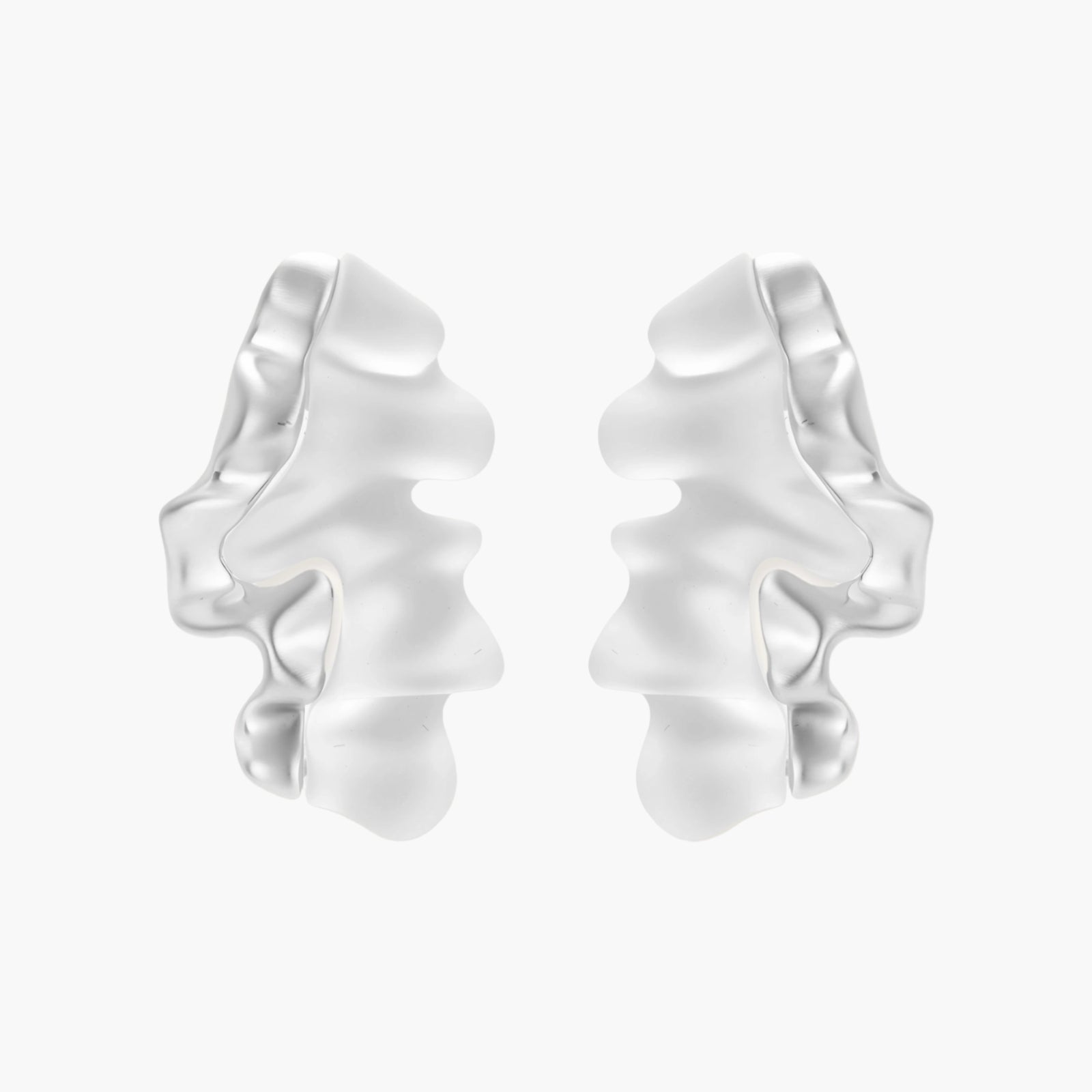 Sculptural wave-textured statement earrings with flowing organic ridges in metallic finish on cream background