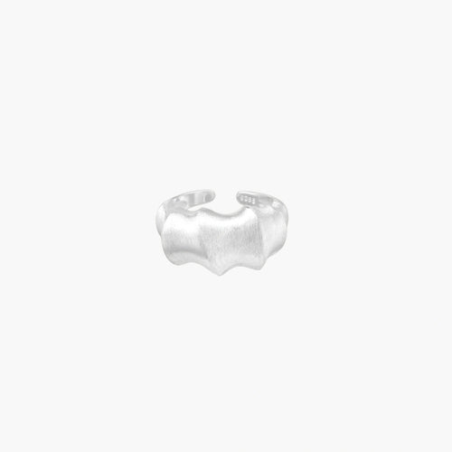 Brushed sterling silver ring with organic wave-like edges and adjustable cuff design on white background